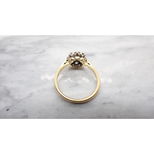 246 - A Diamond Cluster Ring claw-set old-cut stone within eight smaller stones in 18ct gold, ring size N ... 