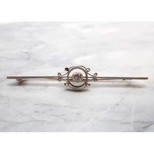 258 - A Diamond Bar Brooch millegrain-set single old-cut stone, estimated 0.30cts, in halo frame on simple... 