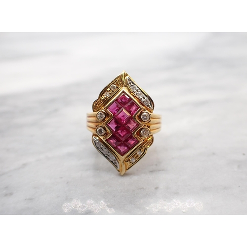 260 - A Ruby and Diamond Cocktail Ring invisibly-set a cluster of ten step-cut rubies within lozenge shape... 