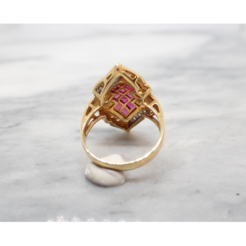 260 - A Ruby and Diamond Cocktail Ring invisibly-set a cluster of ten step-cut rubies within lozenge shape... 