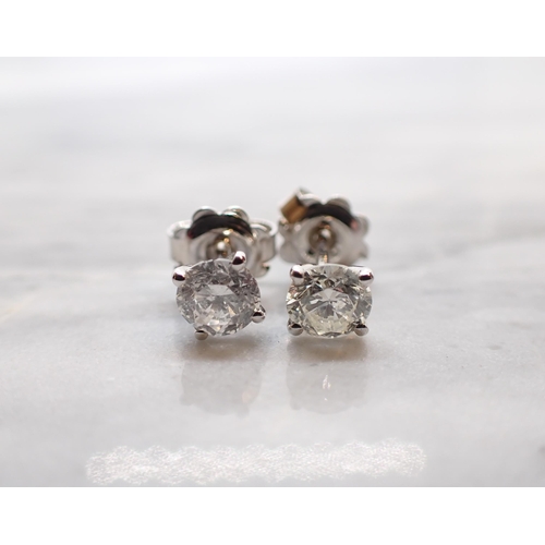 261 - A pair of Diamond Ear Studs each claw-set brilliant-cut stone, total diamond weight 1.26cts, in 18ct... 