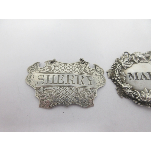 27 - A Victorian silver escutcheon Label, Sherry, Birmingham 1846, maker: George Unite, a Madeira Label, ... 