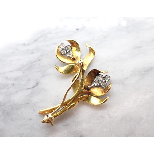 270 - A Diamond Flower Spray Brooch claw-set eight brilliant-cut diamonds in 18ct gold, 40mm long, approx ... 