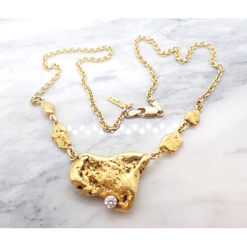 272 - A contemporary Canadian Gold Nugget Necklace the large nugget (tests as 18ct) including some matrix ... 