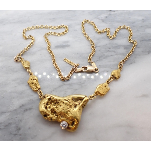 272 - A contemporary Canadian Gold Nugget Necklace the large nugget (tests as 18ct) including some matrix ... 