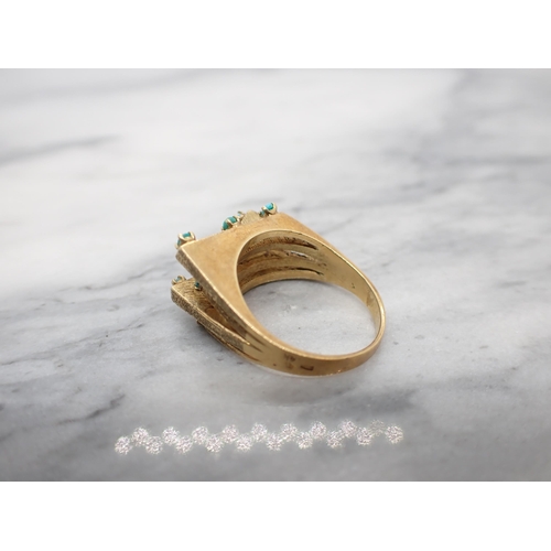 275 - A contemporary Turquoise Ring claw-set twelve small cabochons to the four textured bands in 14ct gol... 