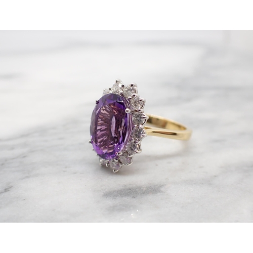 281 - An Amethyst and Diamond Cluster Ring claw-set oval-cut amethyst, 3cts, within a frame of fourteen br... 