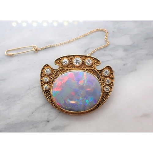 286 - A mid 20th Century Opal and Diamond Brooch millegrain-set oval opal within graduated brilliant-cut d... 