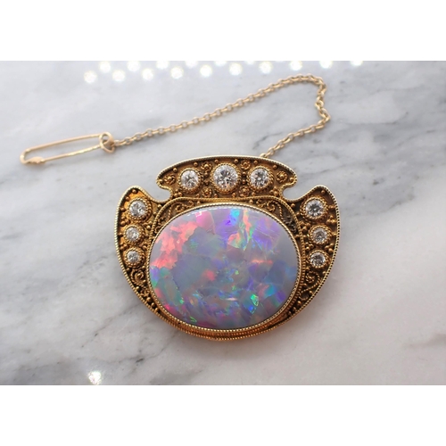 286 - A mid 20th Century Opal and Diamond Brooch millegrain-set oval opal within graduated brilliant-cut d... 