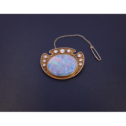 286 - A mid 20th Century Opal and Diamond Brooch millegrain-set oval opal within graduated brilliant-cut d... 