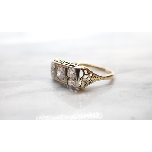 297 - A Diamond five stone Ring pavé-set old-cut stone (chipped) between two pairs of smaller stones, stam... 