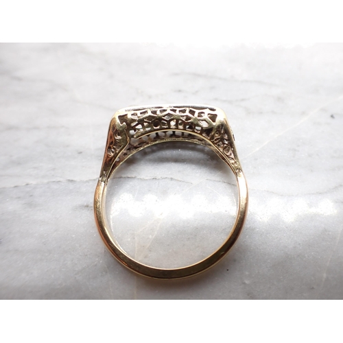 297 - A Diamond five stone Ring pavé-set old-cut stone (chipped) between two pairs of smaller stones, stam... 