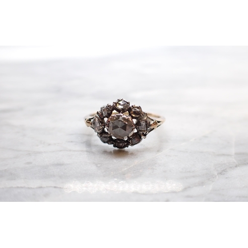 300 - An early 19th Century Diamond Cluster Ring close-set rose-cut stones, ring size N