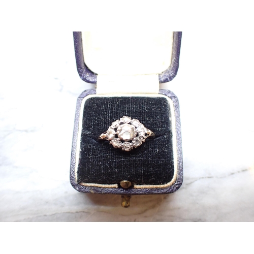 300 - An early 19th Century Diamond Cluster Ring close-set rose-cut stones, ring size N