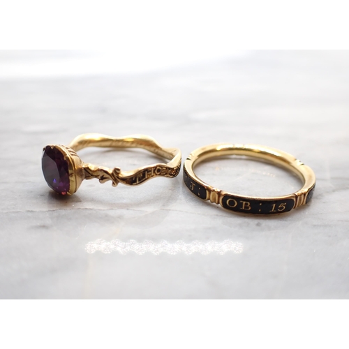 308 - An 18th Century Amethyst Memoriam Ring close-set round foil-backed stone on scrolled shank inlaid bl... 