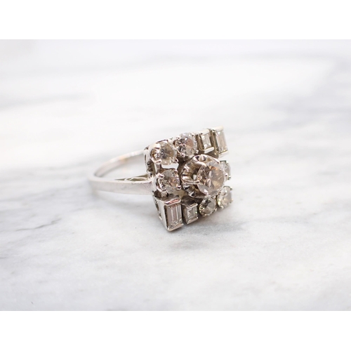 317 - A mid 20th Century Diamond Cluster Ring claw-set old-cut stone within square frame formed by six bri... 