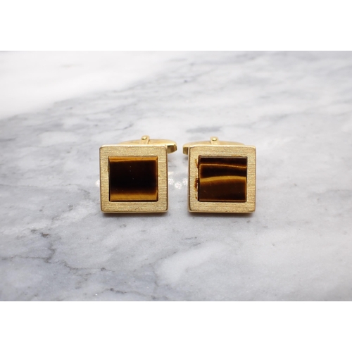 321 - A pair of square Cufflinks set tiger's eye, stamped 750, approx 10.80gms