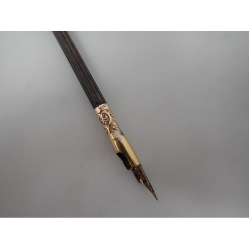 340 - A Victorian 15ct gold mounted Nib Pen with fluted wooden shaft, Birmingham 1879