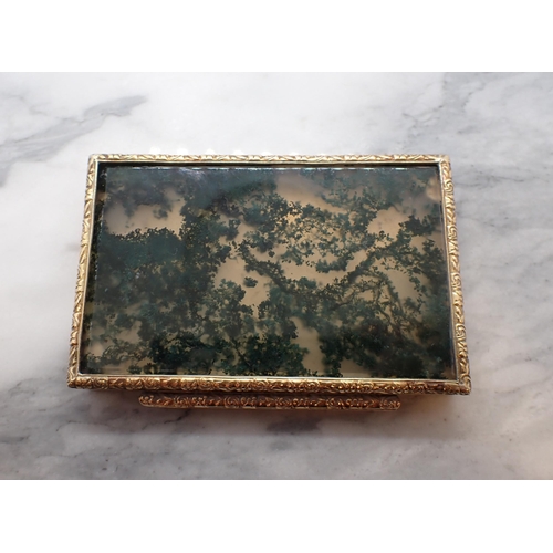 344 - A Continental engraved gold Box the hinged lid set moss agate within floral embossed frame, stamped ... 