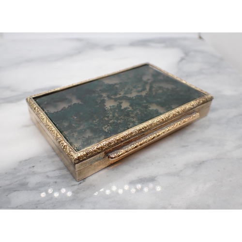 344 - A Continental engraved gold Box the hinged lid set moss agate within floral embossed frame, stamped ... 