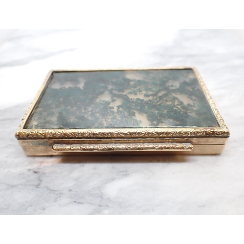 344 - A Continental engraved gold Box the hinged lid set moss agate within floral embossed frame, stamped ... 