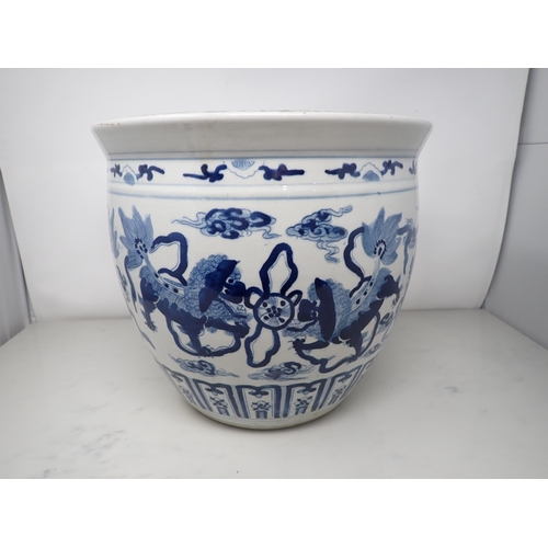 391 - A Chinese blue and white Jardiniere painted four pairs of kylins amongst clouds, etc, 12in diam, 10½... 