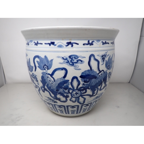 391 - A Chinese blue and white Jardiniere painted four pairs of kylins amongst clouds, etc, 12in diam, 10½... 