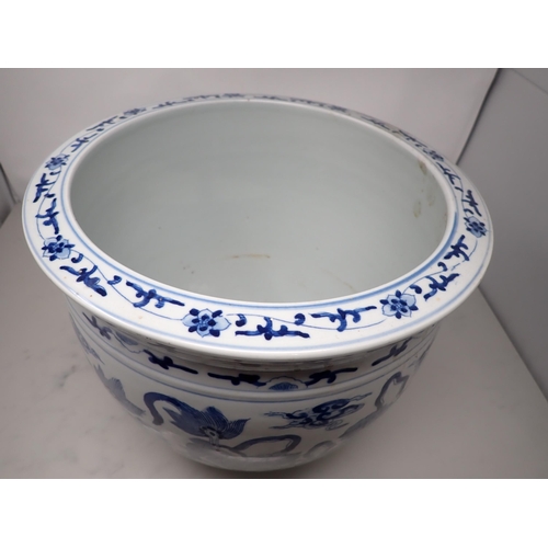 391 - A Chinese blue and white Jardiniere painted four pairs of kylins amongst clouds, etc, 12in diam, 10½... 