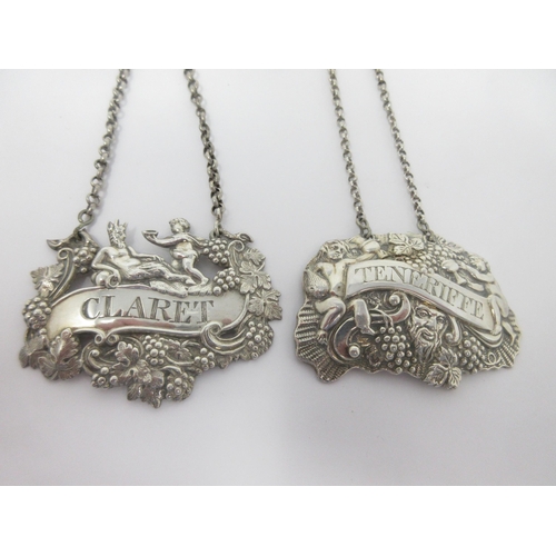 4 - Two early 19th Century Irish silver Labels, Claret and Teneriffe with fruiting vine and cherub embos... 