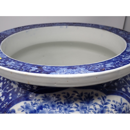 401 - A large Chinese blue and white Fish Bowl with reserves of birds amongst flowering shrubs, prunus sur... 