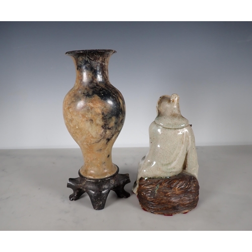 408 - A Chinese carved soapstone baluster Vase with floral and leaf carved decoration on a carved soapston... 