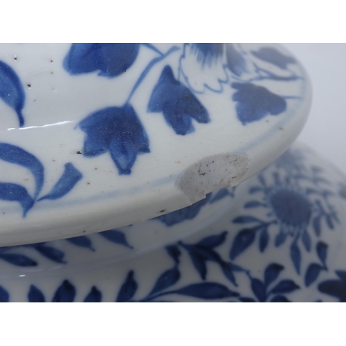 409 - A Chinese blue and white Jar and Cover of baluster form decorated dragons amongst flowers, 15in H, A... 