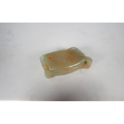 411 - A Chinese Jade Brush Washer of oval form carved flower and leaves, approx 3in wide