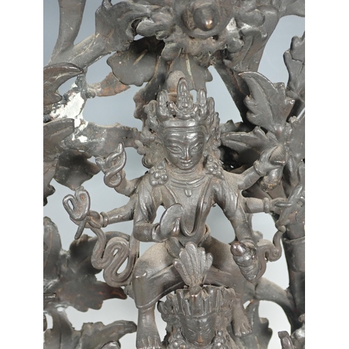 414 - An Indian deity group in bronze with goddesses upon a kylin with leafage background 17in H, incomple... 