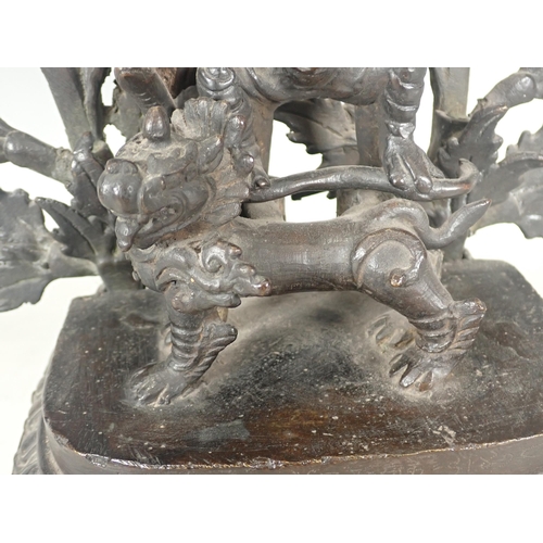 414 - An Indian deity group in bronze with goddesses upon a kylin with leafage background 17in H, incomple... 