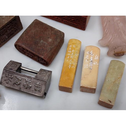 414A - A collection of small Chinese items including three carved wooden Signature Stamps, a child's good l... 