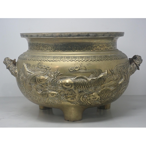 416 - A late 19th Century large Oriental bronze Jardiniere, the frieze design in relief of fish swimming i... 