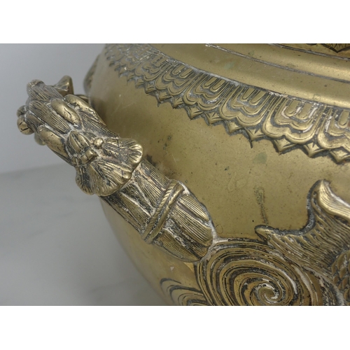 416 - A late 19th Century large Oriental bronze Jardiniere, the frieze design in relief of fish swimming i... 