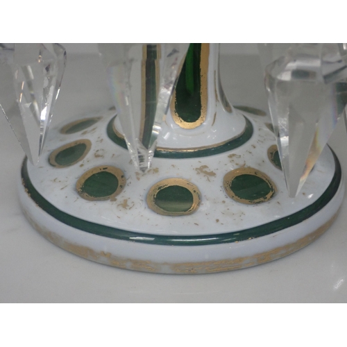 419 - A pair of Victorian green glass Table Lustres, overlaid with opaque glass with prismatic pendant dro... 