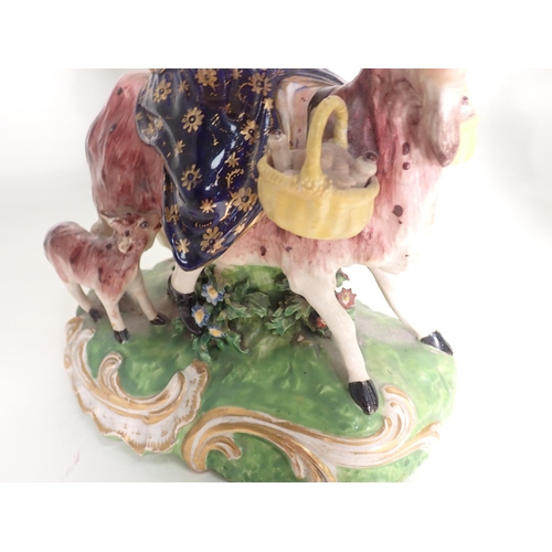 421 - A pair of 19th Century Derby Figures of The Welsh Tailor and his Wife, each figure riding a goat, th... 