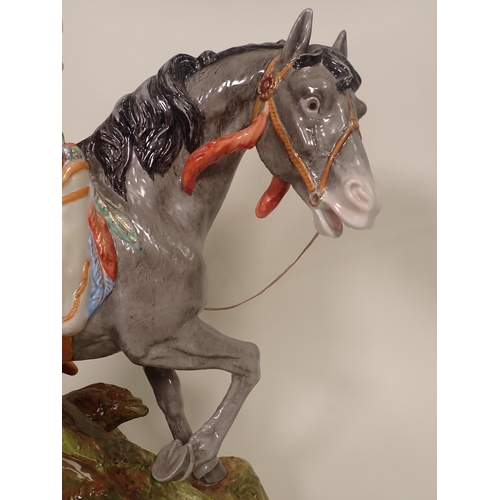 425 - A Lippelsdorf GDR porcelain Figure of a Native American on Horseback 1ft 8 1/2in H