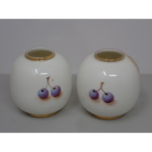 435 - A pair of Royal Worcester ovoid Vases painted still life of fruit, signed 3in H