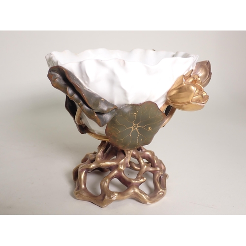 437 - A Moore Basket with cherub having applied moulded flowers, 8in H, a Moore Basket of similar design, ... 