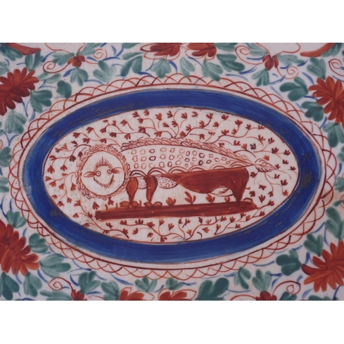 444 - An early 19th Century and later pearl/creamware part Dinner Service, painted central stylised animal... 