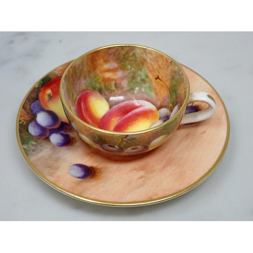 454 - A Royal Worcester miniature Cup and Saucer painted still life of fruit, signed