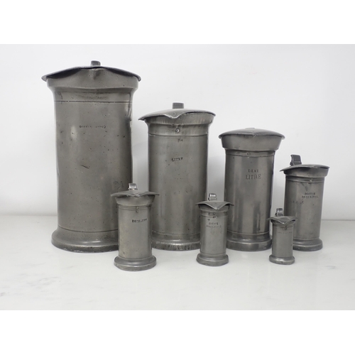 467 - A set of seven French antique pewter graduated Measures with hinged lids, Double Litre - Double Cent... 