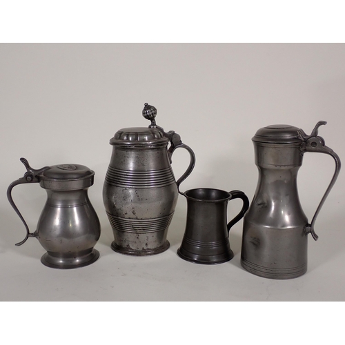 469 - An antique Continental pewter lidded Tankard 9in H, another pewter lidded Tankard with knopped finia... 