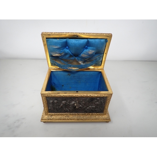 477 - A 19th Century French gilt-metal and bronzed Casket, the inset panels decorated figures merrymaking,... 