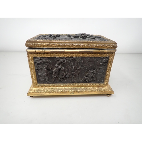 477 - A 19th Century French gilt-metal and bronzed Casket, the inset panels decorated figures merrymaking,... 