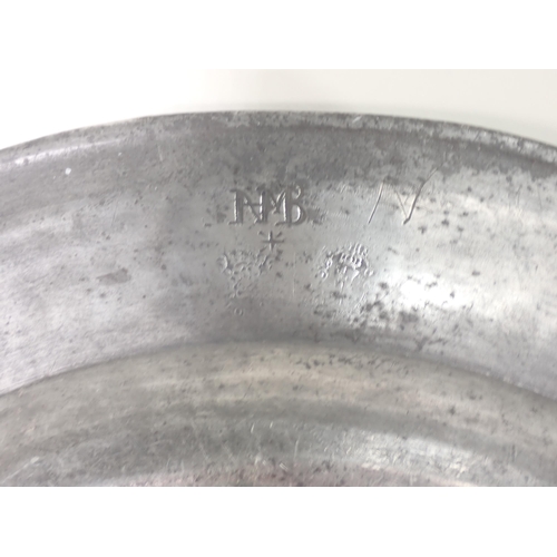 481 - A c.1700 Pewter Charger with touchmarks for John Baskerville, with reeded edge and stamped initials ... 